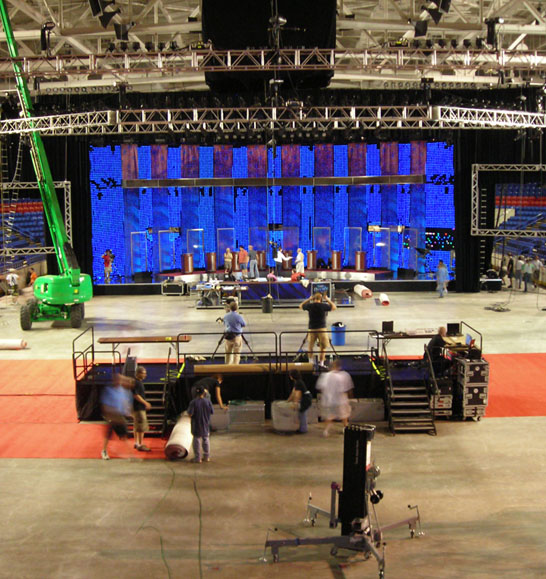 People Setting Up The Stage